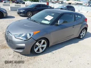 2013 Hyundai Veloster w/Gray Int with VIN KMHTC6AD9DU128725, listed as a IAAI auction lot 42648356 with 168,109 mi miles and . Bid and sale history available at DreamBid. Image 2.