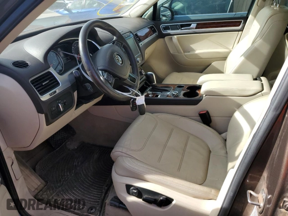 2012 Volkswagen Touareg Exec with VIN WVGEF9BP8CD008665, listed as a Copart auction lot 84611354 with 103,090 mi miles and Salvage Title. Bid and sale history available at DreamBid. Image 7.