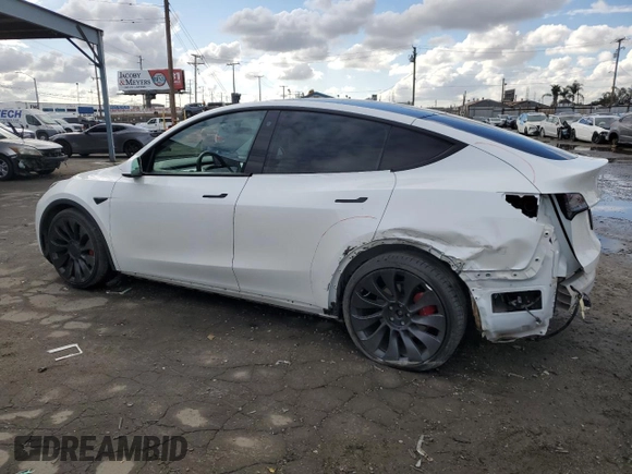 2021 Tesla Model Y Performance with VIN 5YJYGDEF4MF201815, listed as a Copart auction lot 42453075 with 76,888 mi miles and Salvage Title. Bid and sale history available at DreamBid. Image 2.