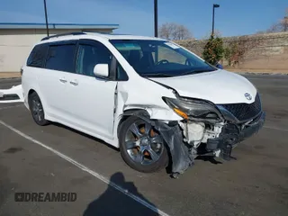 2015 Toyota Sienna SE with VIN 5TDXK3DC6FS627578, listed as a IAAI auction lot 41568684 with 124,138 mi miles. Bid and sale history available at carsss.com. Image 1.