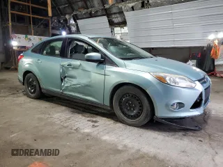 2012 Ford Focus SE with VIN 1FAHP3F27CL149328, listed as a Copart auction lot 56000325 with 147,097 mi miles and Salvage Title. Bid and sale history available at DreamBid. Image 4.