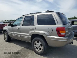 1999 Jeep Grand Cherokee Limited with VIN 1J4GW68N4XC663476, listed as a Copart auction lot 52449925 with 174,583 mi miles and Salvage Title. Bid and sale history available at carsss.com. Image 2.