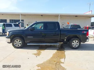 2013 GMC Sierra 1500 SLT with VIN 3GTP2WE71DG146605, listed as a IAAI auction lot 41334159 with 224,640 mi miles. Bid and sale history available at carsss.com. Image 14.