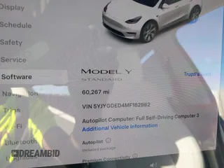 2021 Tesla Model Y Standard Range z VIN 5YJYGDED4MF162982, wystawiony jako IAAI lot #41378674 z przebiegiem 60 267 mil mil oraz . Historia ofert i sprzedaży dostępna na DreamBid. Obrazek 7.