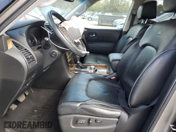 2012 Infiniti QX56 7-passenger with VIN JN8AZ2NE1C9021390, listed as a Copart auction lot 76475574 with 159,671 mi miles and Salvage Title. Bid and sale history available at carsss.com. Image 7.