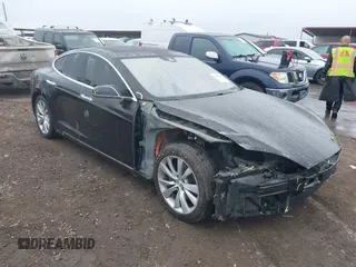 2016 Tesla Model S 70 kWh Battery with VIN 5YJSA1E10GF156578, listed as a IAAI auction lot 41655945 with 56,452 mi miles. Bid and sale history available at carsss.com. Image 1.
