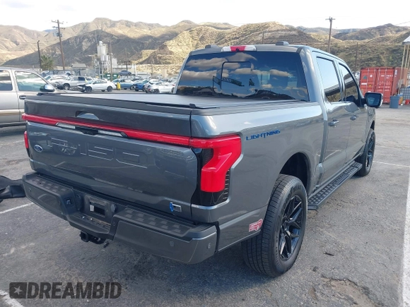 2023 Ford F-150 Lightning Pro with VIN 1FT6W1EV8PWG25191, listed as a IAAI auction lot 41716529 with 5,191 mi miles and . Bid and sale history available at DreamBid. Image 4.