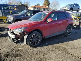 2016 Mazda CX-5 Grand Touring z VIN JM3KE4DY3G0690295, wystawiony jako Copart lot #48741465 z przebiegiem 120 316 mil mil oraz Szkoda całkowita • Salvage title. Historia ofert i sprzedaży dostępna na DreamBid. Obrazek 1.
