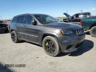 2018 Jeep Grand Cherokee Trackhawk with VIN 1C4RJFN96JC377074, listed as a Copart auction lot 53305975 with 27,625 mi miles and Salvage title. Bid and sale history available at DreamBid. Image 4.