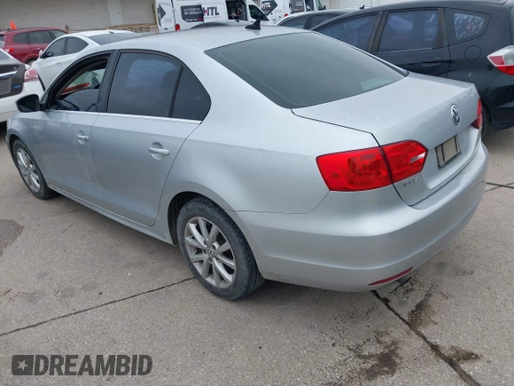 2014 Volkswagen Jetta SE with VIN 3VWD07AJ0EM239714, listed as a IAAI auction lot 42428082 with 124,221 mi miles and . Bid and sale history available at DreamBid. Image 3.