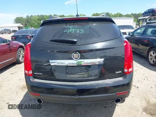 2015 Cadillac SRX Performance Collection z VIN 3GYFNCE30FS549872, wystawiony jako IAAI lot #42201529 z przebiegiem 125 128 mil mil oraz . Historia ofert i sprzedaży dostępna na DreamBid. Obrazek 17.