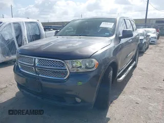 2013 Dodge Durango SXT with VIN 1C4RDHAG4DC686389, listed as a IAAI auction lot 42440260 with 166,952 mi miles and . Bid and sale history available at DreamBid. Image 2.