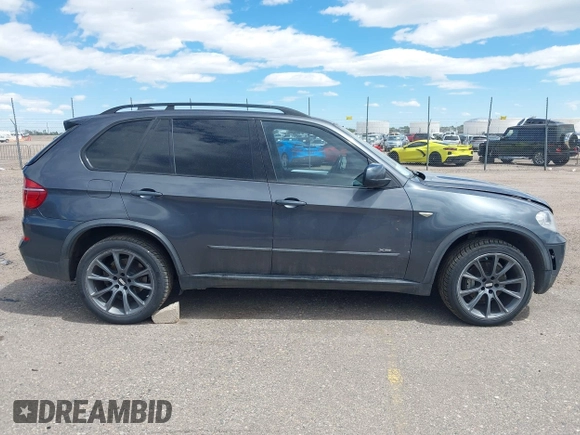 2012 BMW X5 35i z VIN 5UXZV4C53CL987556, wystawiony jako IAAI lot #42297756 z przebiegiem 190 922 mil mil oraz . Historia ofert i sprzedaży dostępna na DreamBid. Obrazek 13.