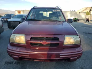 1999 Suzuki Vitara JX z VIN 2S3TD52V6X6101702, wystawiony jako Copart lot #42596125 z przebiegiem 225 614 mil mil oraz Tytuł czysty. Historia ofert i sprzedaży dostępna na DreamBid. Obrazek 5.