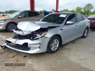 2018 Kia Optima LX z VIN 5XXGT4L3XJG231457, wystawiony jako IAAI lot #42255585 z przebiegiem 75 877 mil mil oraz . Historia ofert i sprzedaży dostępna na DreamBid. Obrazek 2.