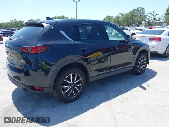 2017 Mazda CX-5 Grand Touring with VIN JM3KFBDL6H0200830, listed as a IAAI auction lot 42005145 with 90,510 mi miles. Bid and sale history available at carsss.com. Image 4.