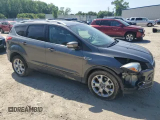 2015 Ford Escape Titanium with VIN 1FMCU9J92FUC74879, listed as a Copart auction lot 54683185 with 143,436 mi miles and Salvage title. Bid and sale history available at DreamBid. Image 4.