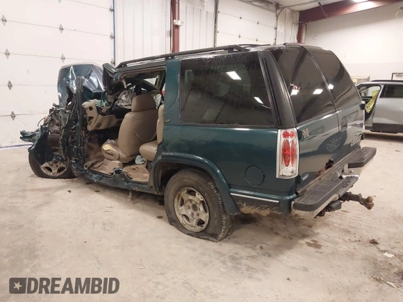 1998 Chevrolet Tahoe z VIN 1GNEK13R7WJ379752, wystawiony jako IAAI lot #42026616 z przebiegiem 270 881 mil mil oraz . Historia ofert i sprzedaży dostępna na DreamBid. Obrazek 3.
