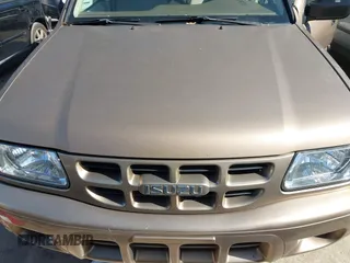 2001 Isuzu Rodeo S with VIN 4S2CK58W414322118, listed as a IAAI auction lot 41496624 with 244,189 mi miles and . Bid and sale history available at DreamBid. Image 6.