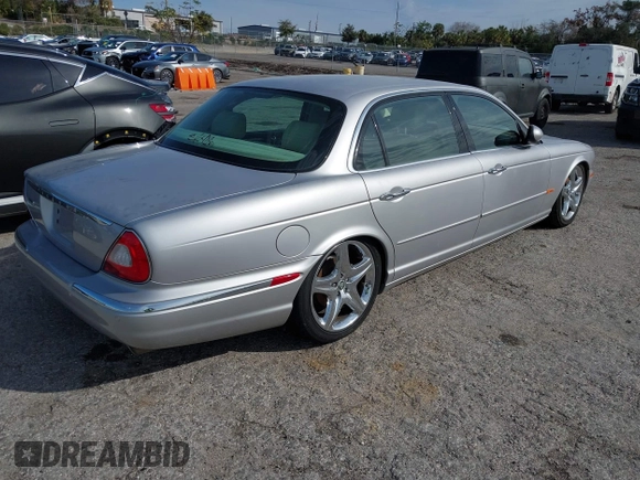 2005 Jaguar XJ with VIN SAJWA79C05SG45650, listed as a IAAI auction lot 41262315 with 76,127 mi miles. Bid and sale history available at carsss.com. Image 4.