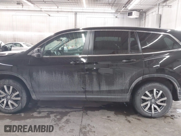 2021 Honda Pilot EX-L with VIN 5FNYF6H50MB092898, listed as a IAAI auction lot 41530673 with 28,505 mi miles. Bid and sale history available at carsss.com. Image 14.