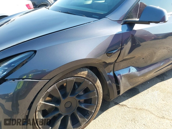 2022 Tesla Model Y Long Range z VIN 7SAYGDEE4NF522698, wystawiony jako IAAI lot #41287885 z przebiegiem 82 306 mil mil oraz . Historia ofert i sprzedaży dostępna na DreamBid. Obrazek 6.