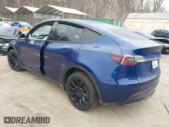 2025 Tesla Model Y Long Range with VIN 7SAYGDED9SF248370, listed as a IAAI auction lot 41336869 with 2,499 mi miles and . Bid and sale history available at DreamBid. Image 3.