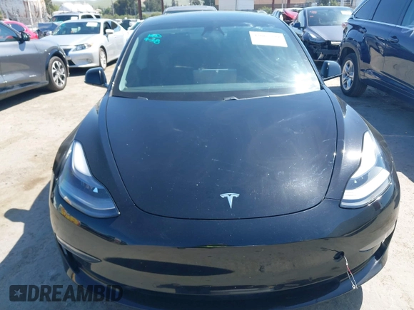2021 Tesla Model 3 Long Range with VIN 5YJ3E1EB2MF065583, listed as a IAAI auction lot 42067399 with 52,333 mi miles. Bid and sale history available at carsss.com. Image 6.