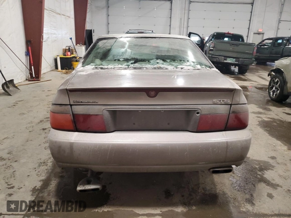 1998 Cadillac Seville STS z VIN 1G6KY5490WU916771, wystawiony jako Copart lot #58699555 z przebiegiem 129 944 mil mil oraz Nie do naprawy. Historia ofert i sprzedaży dostępna na DreamBid. Obrazek 6.