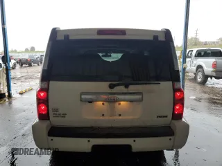 2010 Jeep Commander Limited with VIN 1J4RG5GT0AC137563, listed as a Copart auction lot 54178235 with 146,196 mi miles and Salvage title. Bid and sale history available at DreamBid. Image 6.