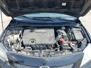 2009 Toyota Corolla with VIN 1NXBU40E29Z085117, listed as a IAAI auction lot 42059893 with 199,576 mi miles. Bid and sale history available at carsss.com. Image 10.