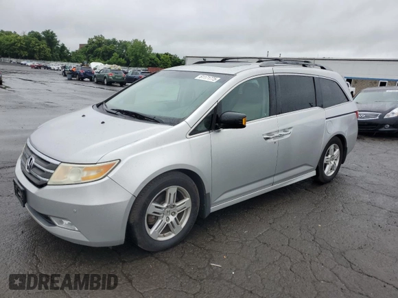 2011 Honda Odyssey Touring with VIN 5FNRL5H99BB021223, listed as a Copart auction lot 61171775 with 194,029 mi miles and Salvage title. Bid and sale history available at DreamBid. Image 1.