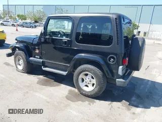 2001 Jeep Wrangler Sahara z VIN 1J4FA59S41P313113, wystawiony jako IAAI lot #42266173 z przebiegiem 125 792 mil mil oraz . Historia ofert i sprzedaży dostępna na DreamBid. Obrazek 3.