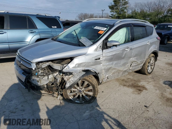 2017 Ford Escape Titanium with VIN 1FMCU9J95HUA48080, listed as a Copart auction lot 83202034 with 122,528 mi miles and Salvage Title. Bid and sale history available at carsss.com. Image 1.