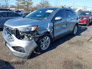2020 Ford Edge Titanium z VIN 2FMPK4K96LBA00515, wystawiony jako IAAI lot #41757974 z przebiegiem 76 242 mil mil oraz . Historia ofert i sprzedaży dostępna na DreamBid. Obrazek 2.