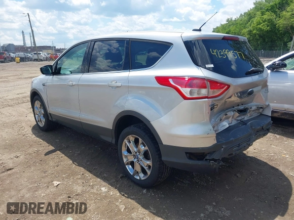 2013 Ford Escape SEL z VIN 1FMCU9H94DUD19842, wystawiony jako IAAI lot #42399577 z przebiegiem 176 257 mil mil oraz . Historia ofert i sprzedaży dostępna na DreamBid. Obrazek 3.