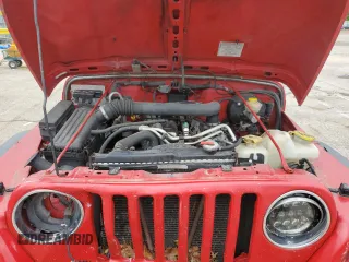 2005 Jeep Wrangler Sport z VIN 1J4FA49S75P317995, wystawiony jako Copart lot #58060055 z przebiegiem 189 332 mil mil oraz Szkoda całkowita • Salvage title. Historia ofert i sprzedaży dostępna na DreamBid. Obrazek 11.