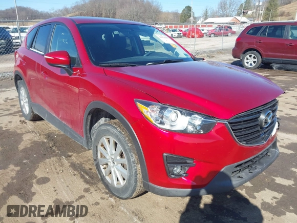 2016 Mazda CX-5 Touring with VIN JM3KE4CY4G0860035, listed as a IAAI auction lot 41678299 with 72,101 mi miles. Bid and sale history available at carsss.com. Image 1.