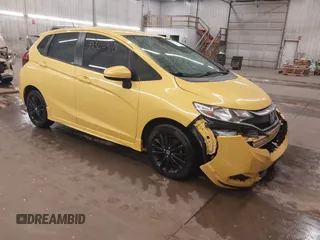 2018 Honda Fit Sport z VIN 3HGGK5G61JM711285, wystawiony jako IAAI lot #42300510 z przebiegiem 115 642 mil mil oraz . Historia ofert i sprzedaży dostępna na DreamBid. Obrazek 1.