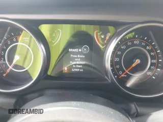 2022 Jeep Gladiator Willys Sport z VIN 1C6HJTAG7NL161701, wystawiony jako IAAI lot #42097144 z przebiegiem 32 989 mil mil oraz . Historia ofert i sprzedaży dostępna na DreamBid. Obrazek 7.