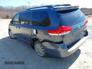 2014 Toyota Sienna LE with VIN 5TDJK3DC4ES087457, listed as a IAAI auction lot 41773128 with 103,993 mi miles and . Bid and sale history available at DreamBid. Image 3.