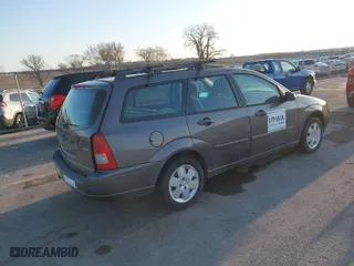 2006 Ford Focus SE with VIN 1FAHP36N16W228667, listed as a IAAI auction lot 41965634 with 141,460 mi miles. Bid and sale history available at carsss.com. Image 4.