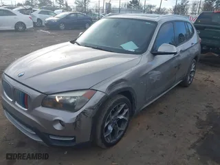 2014 BMW X1 sDrive28i with VIN WBAVM1C52EVW48857, listed as a IAAI auction lot 41179830 with 113,315 mi miles. Bid and sale history available at carsss.com. Image 2.