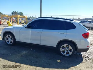 2015 BMW X1 sDrive28i with VIN WBAVM1C53FV317173, listed as a IAAI auction lot 41586385 with 146,068 mi miles. Bid and sale history available at carsss.com. Image 14.