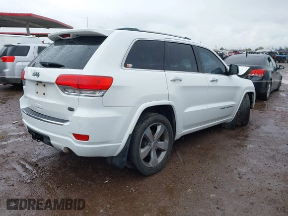 2014 Jeep Grand Cherokee Overland with VIN 1C4RJFCG9EC162098, listed as a IAAI auction lot 41746022 with 120,588 mi miles and . Bid and sale history available at DreamBid. Image 4.