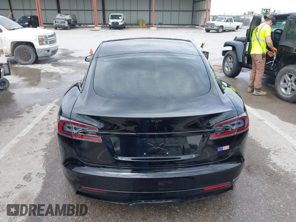 2022 Tesla Model S Plaid with VIN 5YJSA1E60NF460244, listed as a IAAI auction lot 41996403 with Not provided miles and . Bid and sale history available at DreamBid. Image 16.
