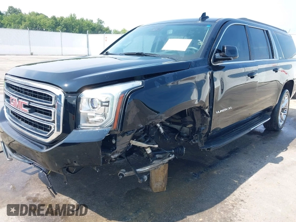 2016 GMC Yukon XL SLE with VIN 1GKS1FKC9GR161876, listed as a IAAI auction lot 39948106 with 60,800 mi miles. Bid and sale history available at carsss.com. Image 6.