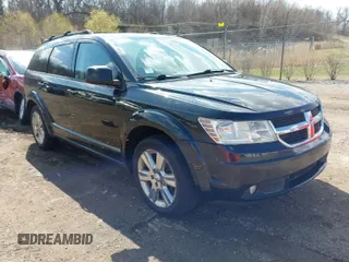 2010 Dodge Journey SXT with VIN 3D4PH5FV4AT135822, listed as a IAAI auction lot 42012480 with 124,480 mi miles. Bid and sale history available at carsss.com. Image 1.