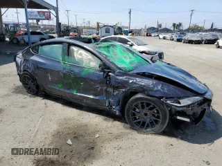 2025 Tesla Model 3 Long Range with VIN 5YJ3E1EA5SF999984, listed as a Copart auction lot 58244825 with Not provided miles and Salvage title. Bid and sale history available at DreamBid. Image 4.