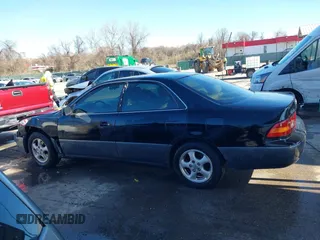 1997 Lexus ES 300 Luxury Sport Sdn with VIN JT8BF22GXV5003056, listed as a IAAI auction lot 41806886 with 130,063 mi miles. Bid and sale history available at carsss.com. Image 14.
